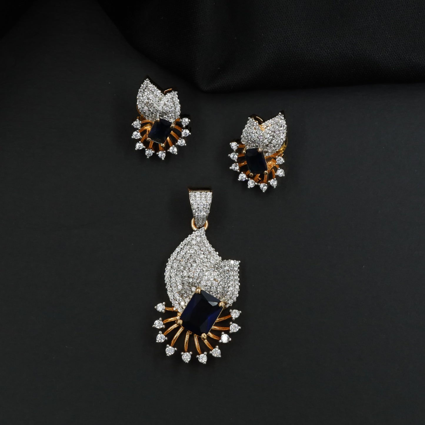 Crescent fan pendant set with geometric centerpiece detailing