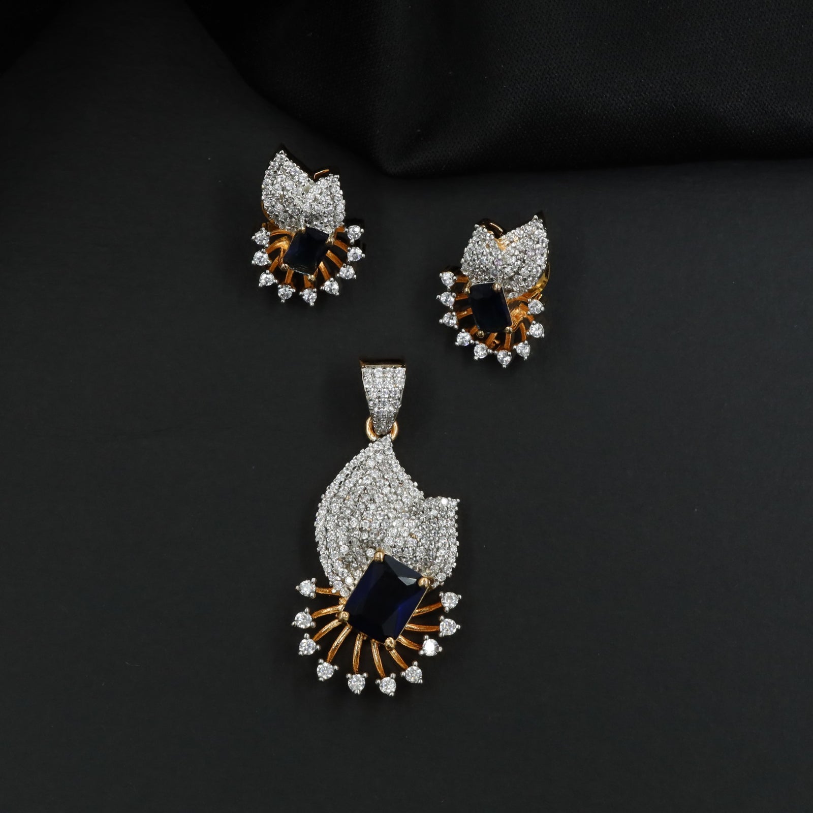 Crescent fan pendant set with geometric centerpiece detailing