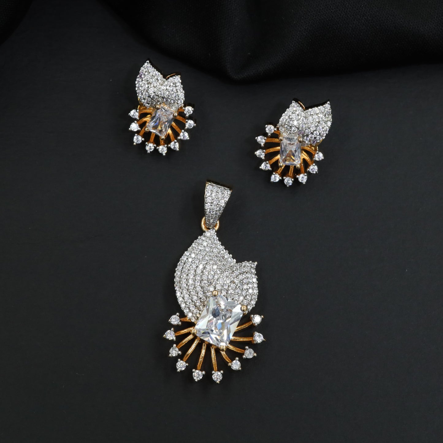Crescent fan pendant set with geometric centerpiece detailing