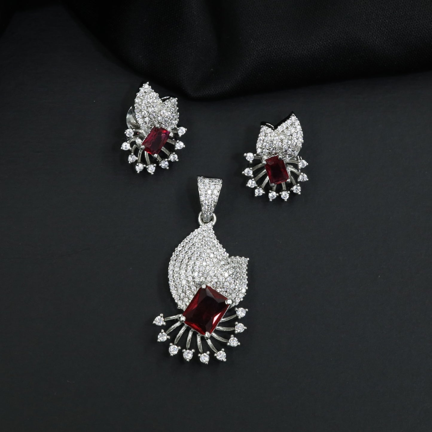 Crescent fan pendant set with geometric centerpiece detailing