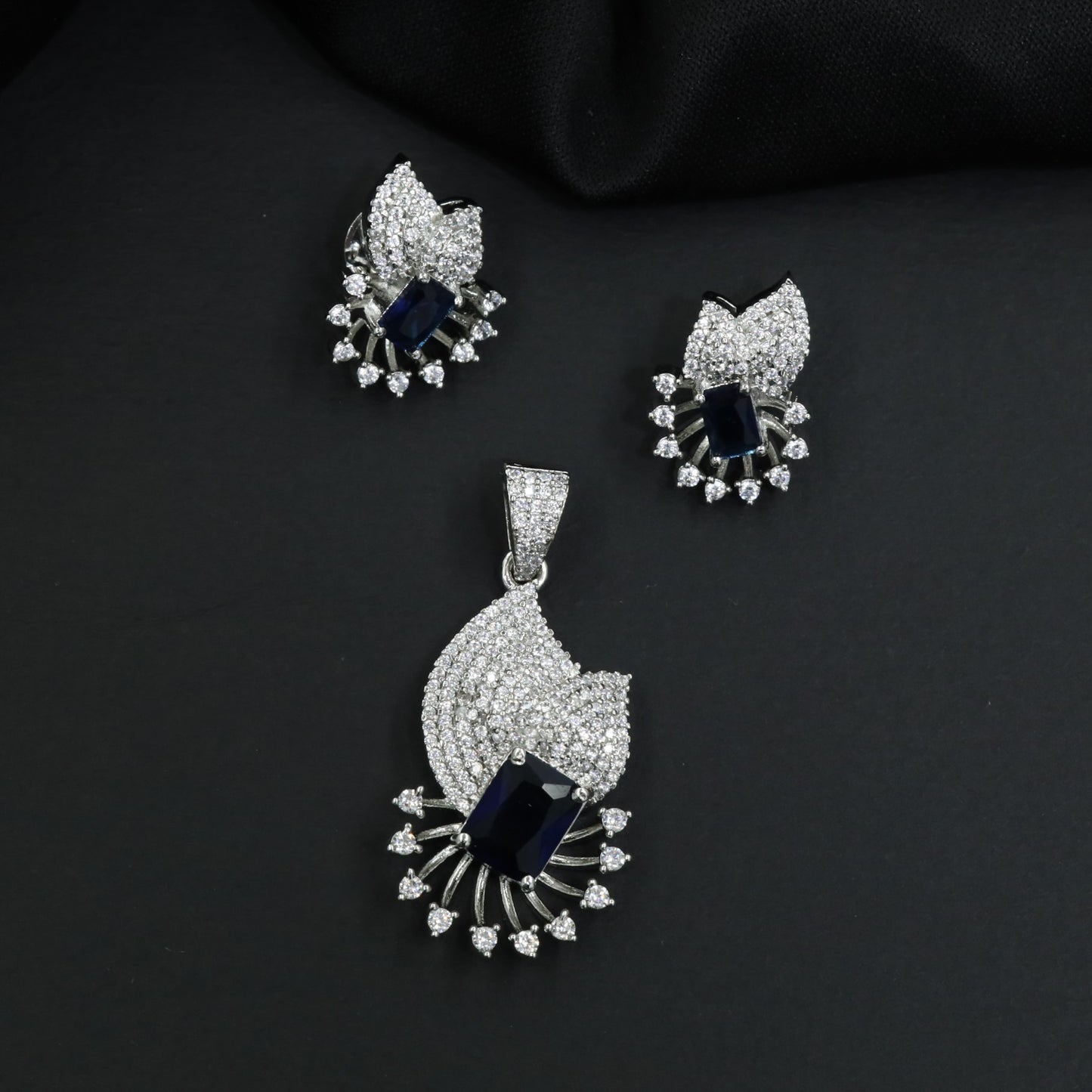 Crescent fan pendant set with geometric centerpiece detailing