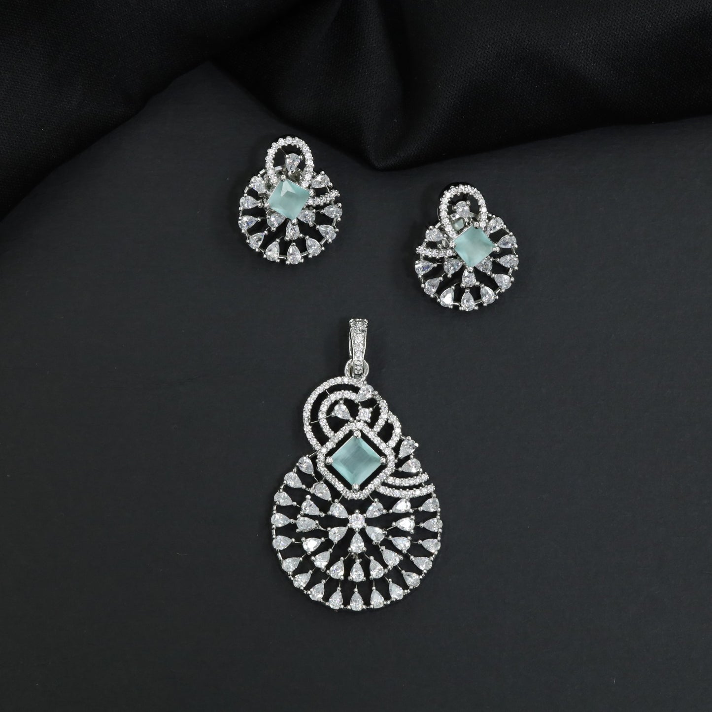 Statement drop pendant set with fan motif construction and matching earrings