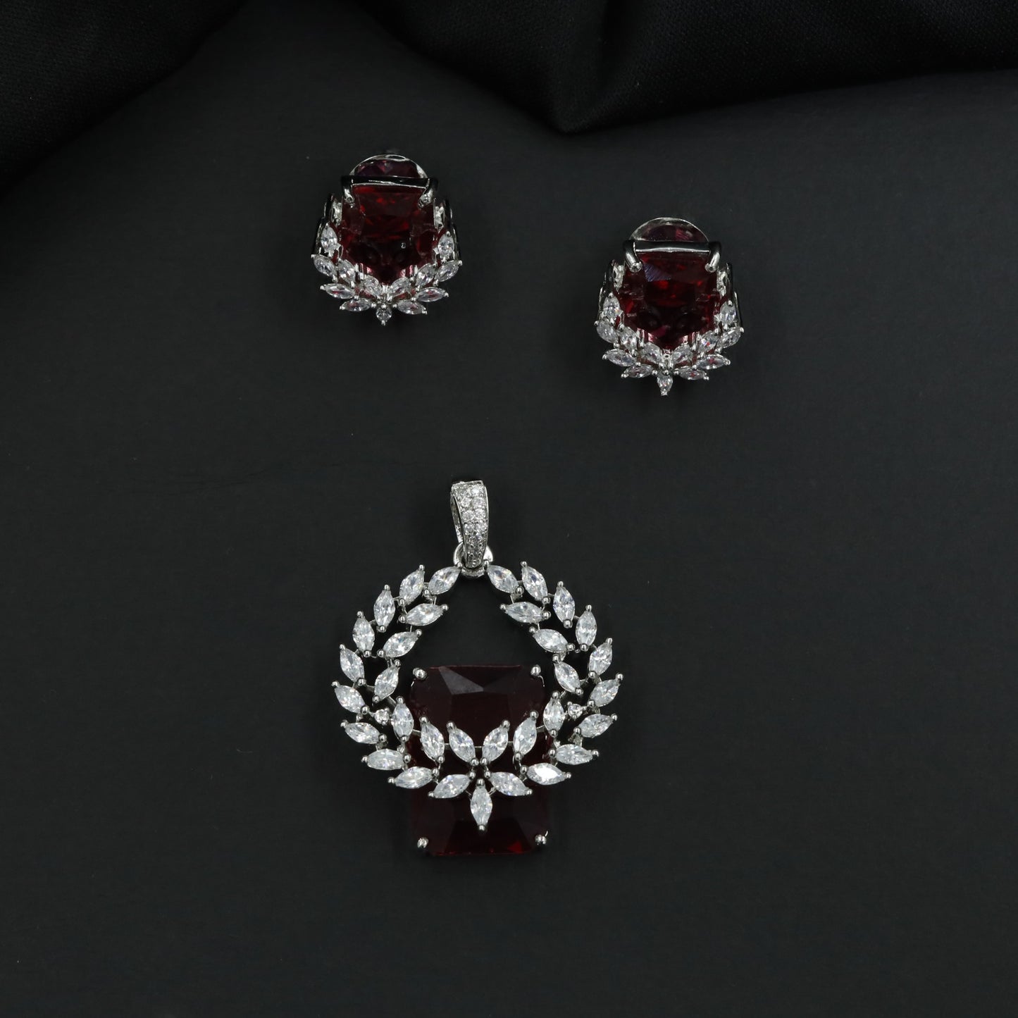 Open wreath pendant set with marquise cluster detailing and drop design