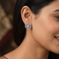 Floral Pinwheel Stud Earrings with Circular Border Design