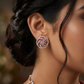 Floral Pinwheel Stud Earrings with Circular Border Design