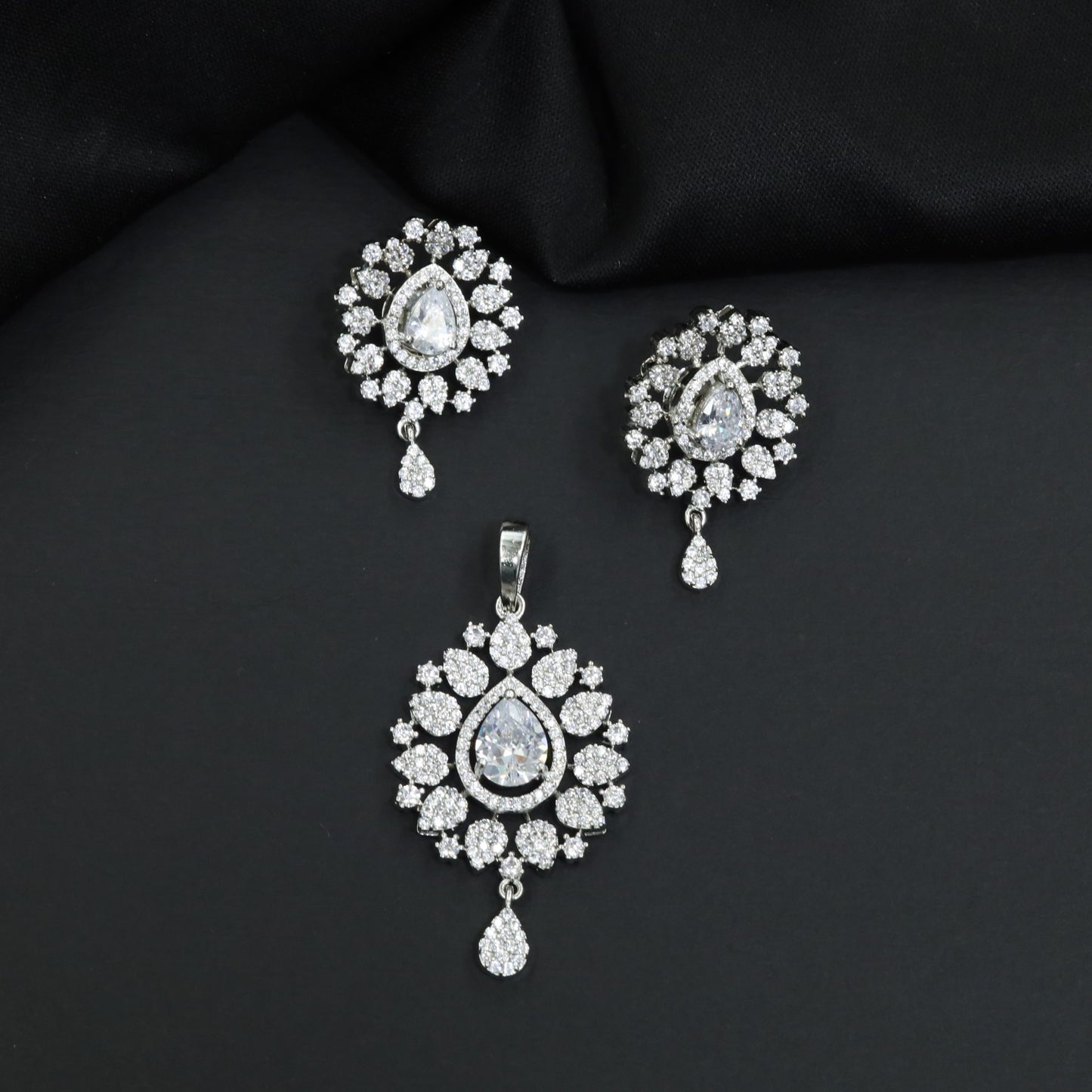 Contemporary pendant set with floral cluster craftsmanship and matching earrings