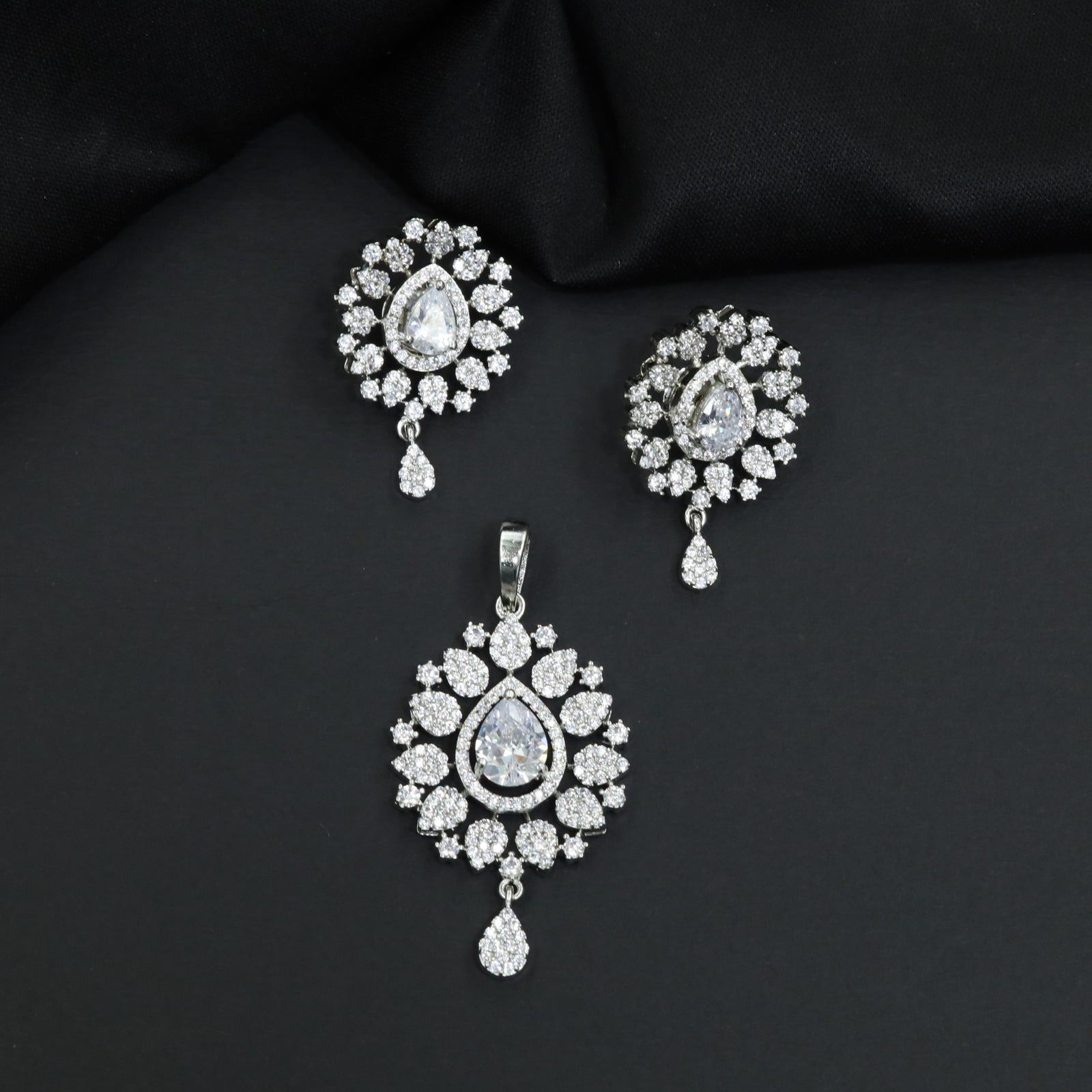 Contemporary pendant set with floral cluster craftsmanship and matching earrings