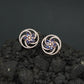 Floral Pinwheel Stud Earrings with Circular Border Design