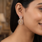 Floral Halo Rose Gold Hanging Earrings with Circular Frame Design