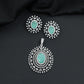 Rhodium finish pendant set with oval drop and radiant border design