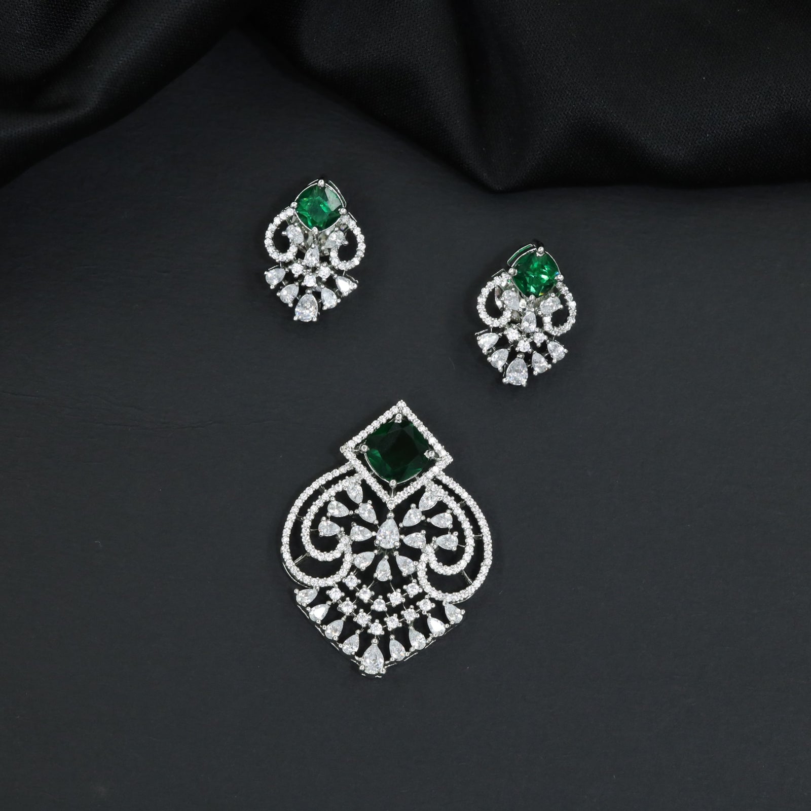 Festive pendant set with ornate openwork patterns and matching earrings