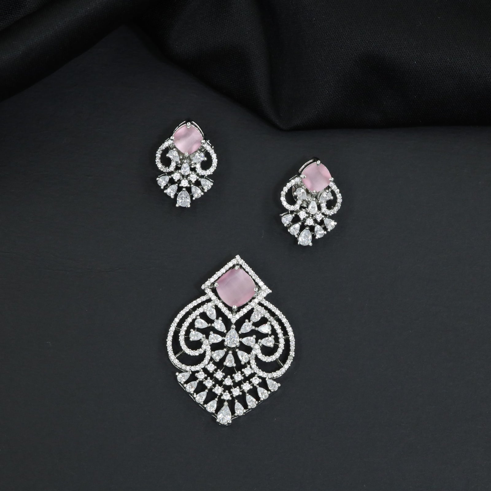Festive pendant set with ornate openwork patterns and matching earrings