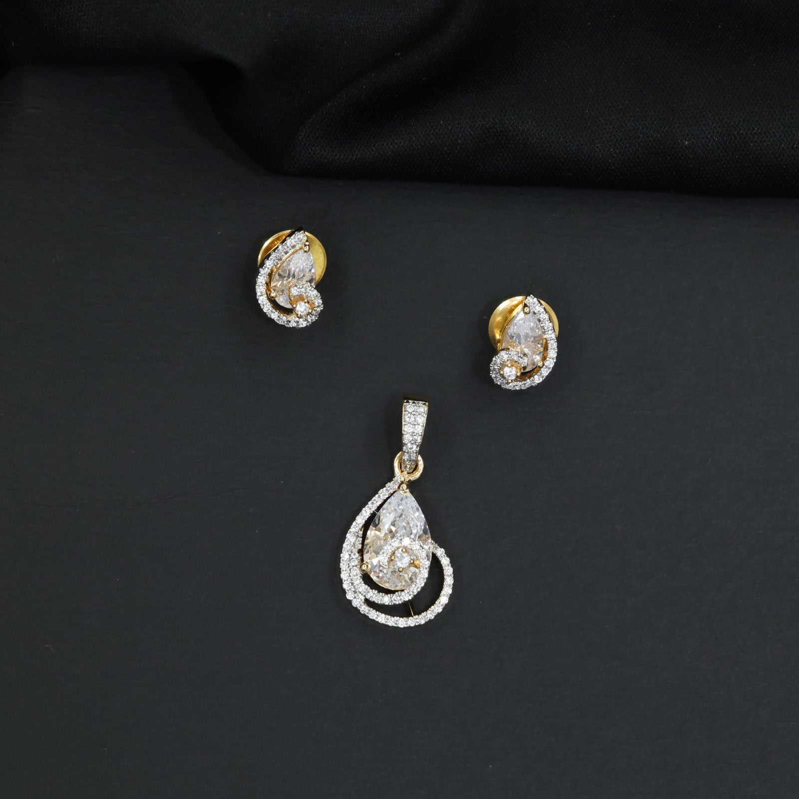 Teardrop halo pendant set with double loop frame detailing