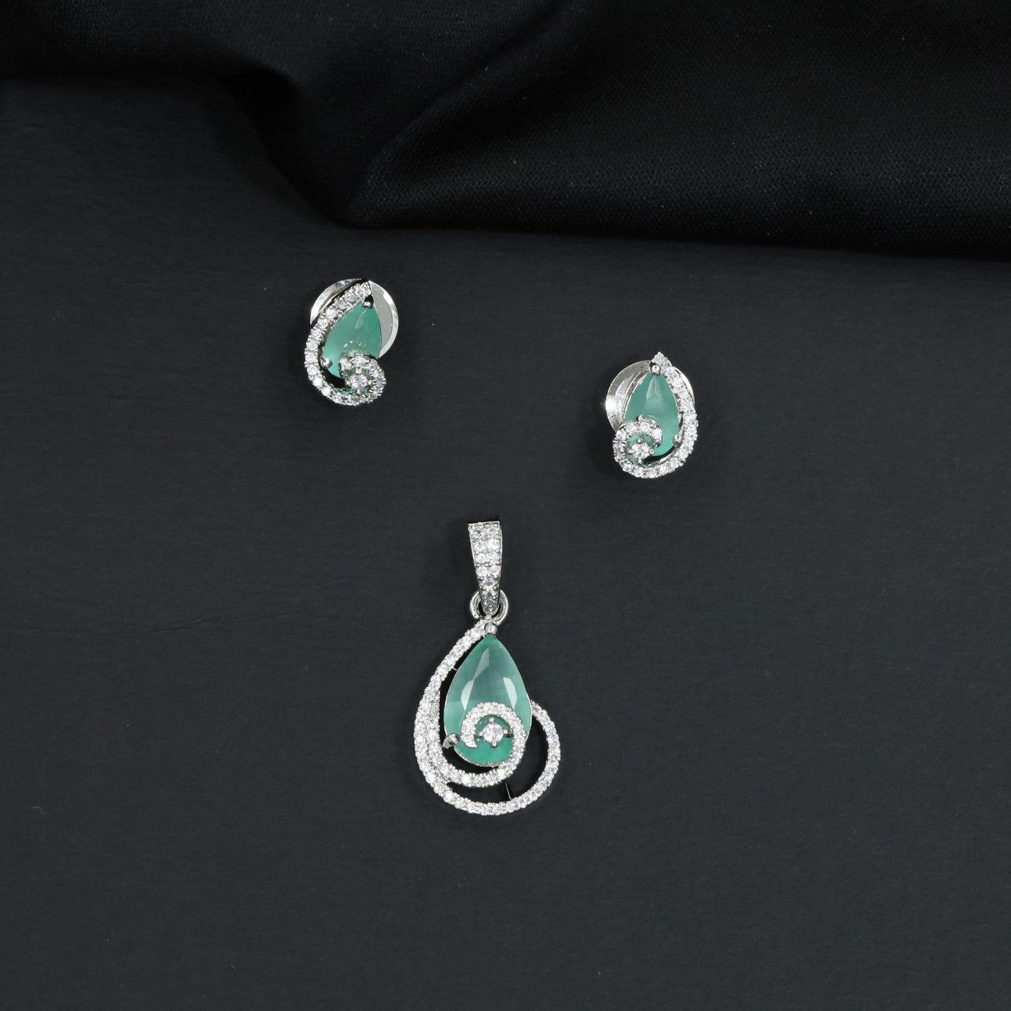 Teardrop halo pendant set with double loop frame detailing