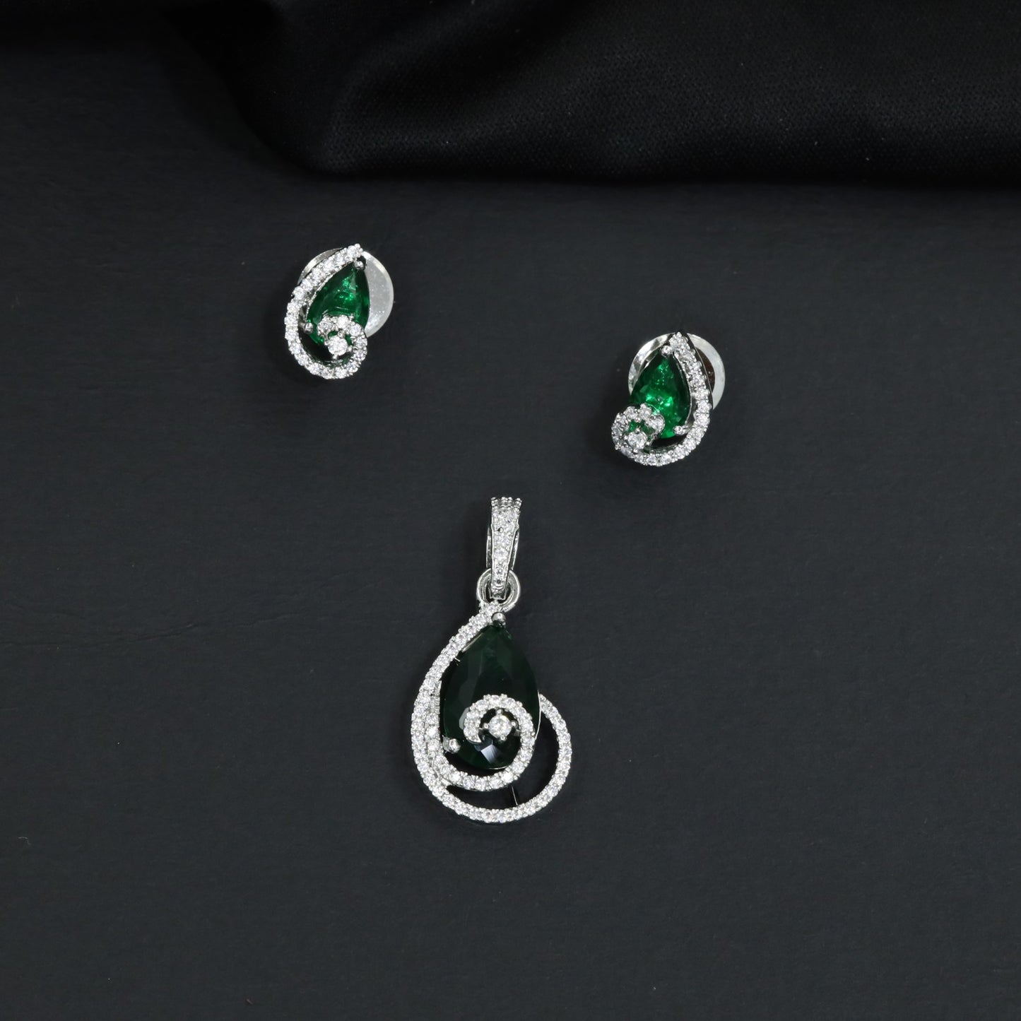 Teardrop halo pendant set with double loop frame detailing