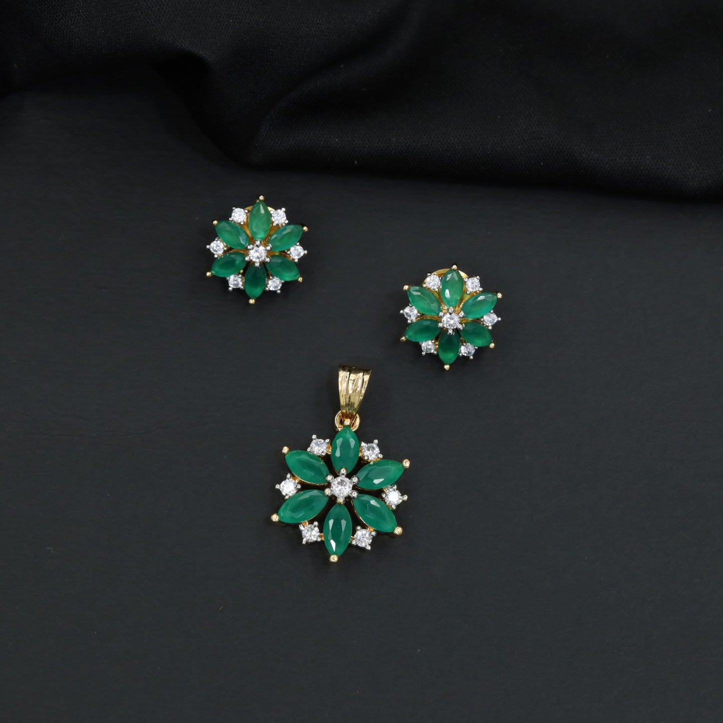 Floral bloom pendant set with marquise petal detailing and matching stud earrings