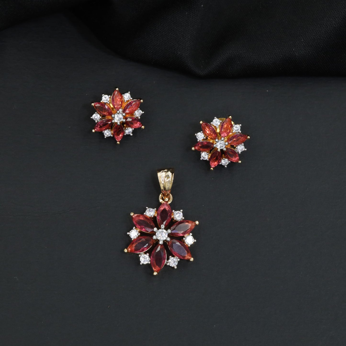 Floral bloom pendant set with marquise petal detailing and matching stud earrings