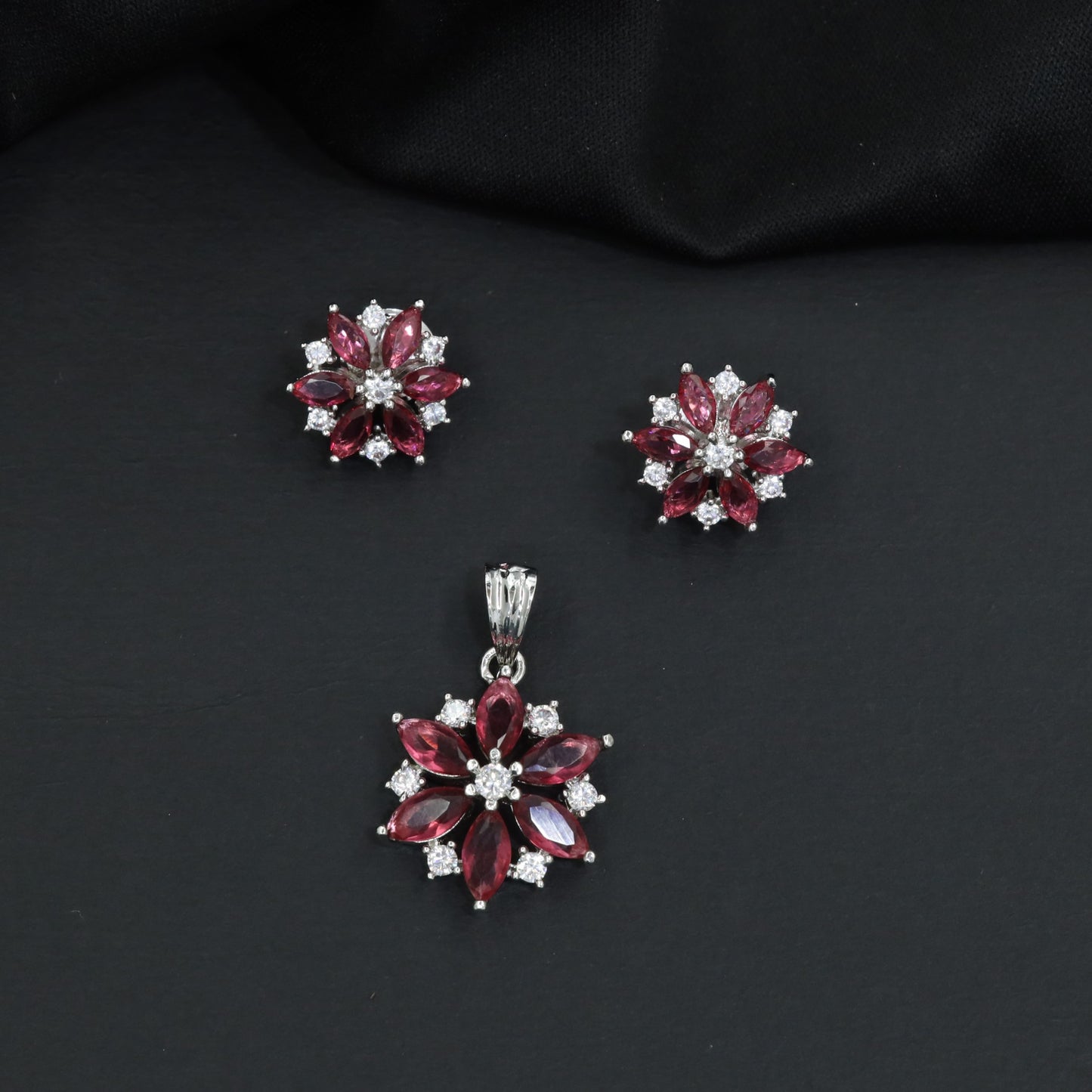 Floral bloom pendant set with marquise petal detailing and matching stud earrings