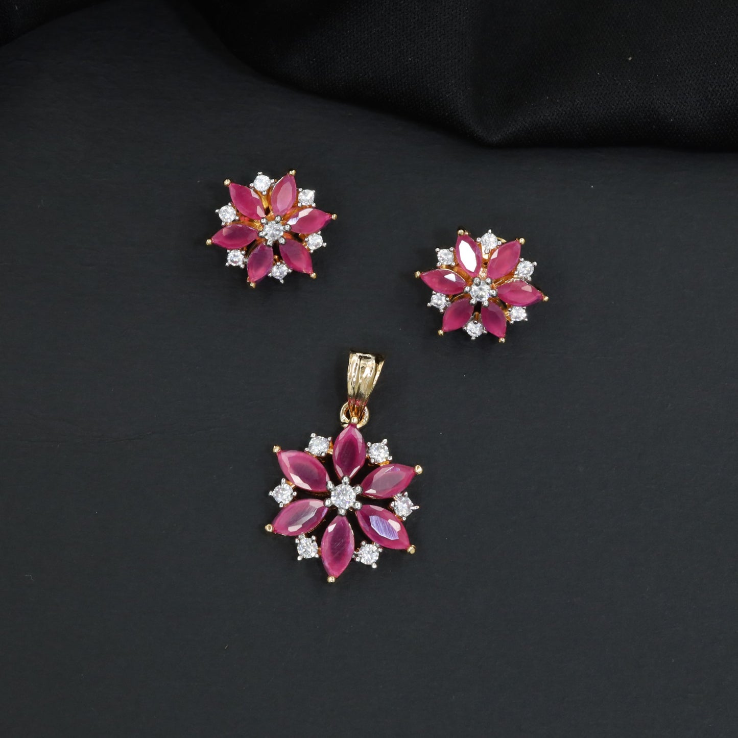 Floral bloom pendant set with marquise petal detailing and matching stud earrings