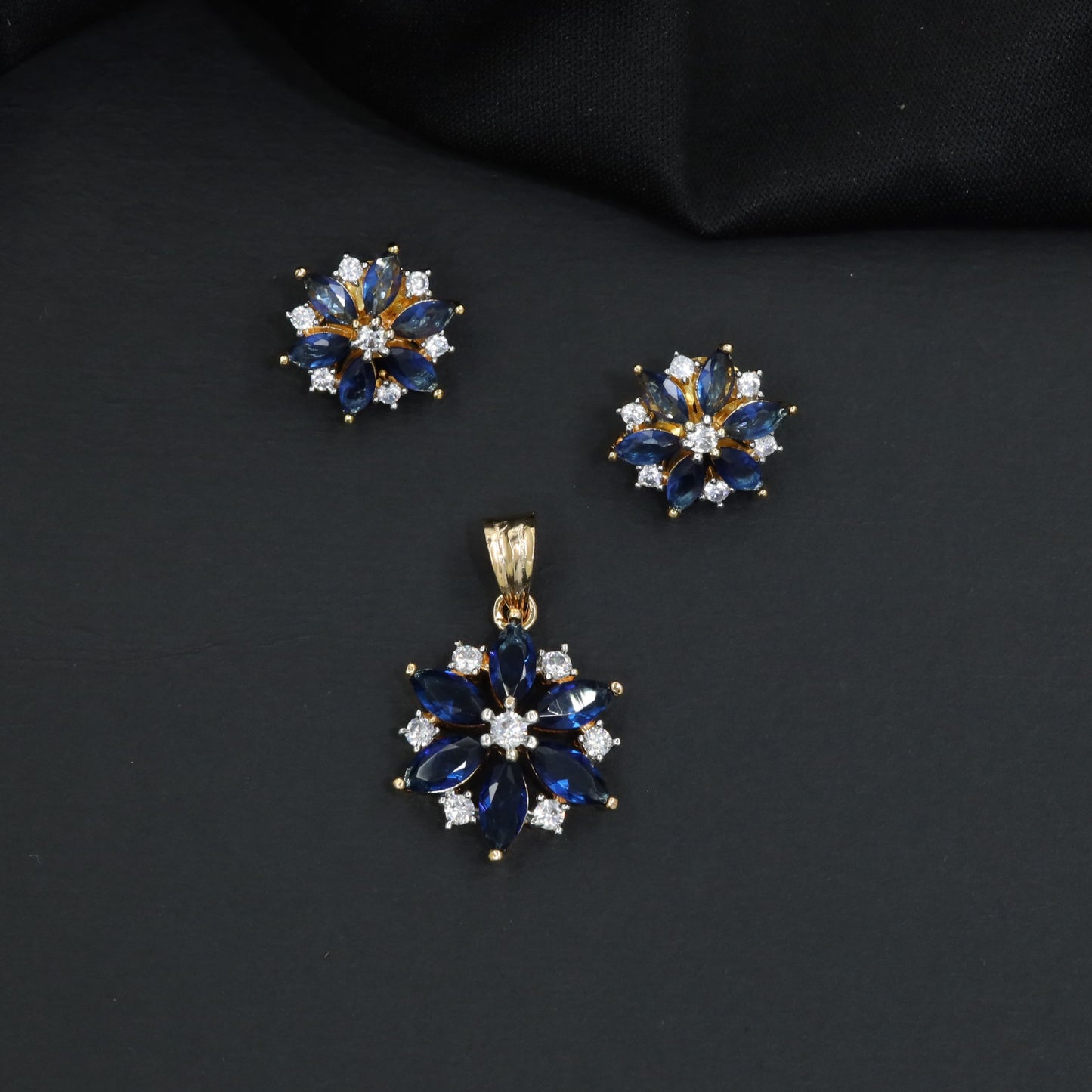 Floral bloom pendant set with marquise petal detailing and matching stud earrings