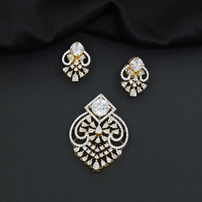 Handcrafted pendant set with floral filigree artistry and teardrop-shaped construction