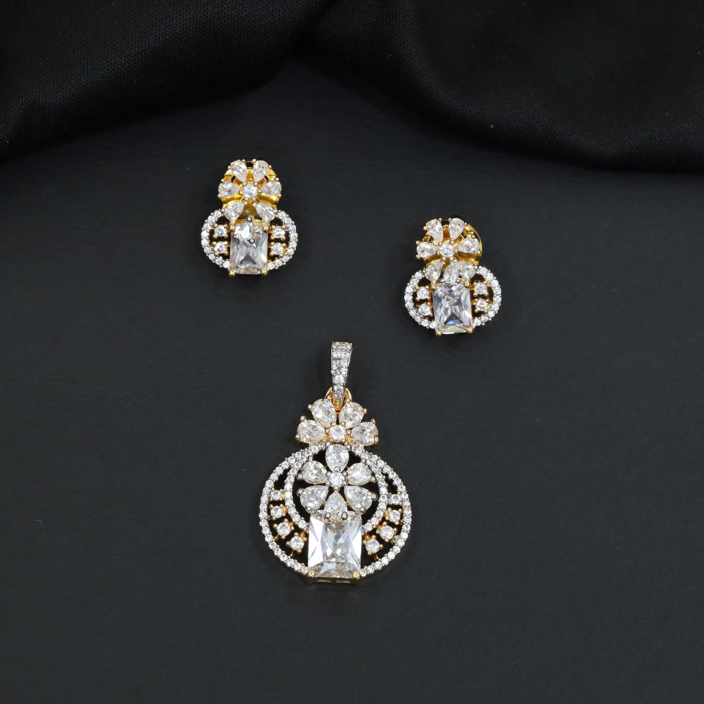 Contemporary floral pendant set showcasing geometric styling and petal cluster accents