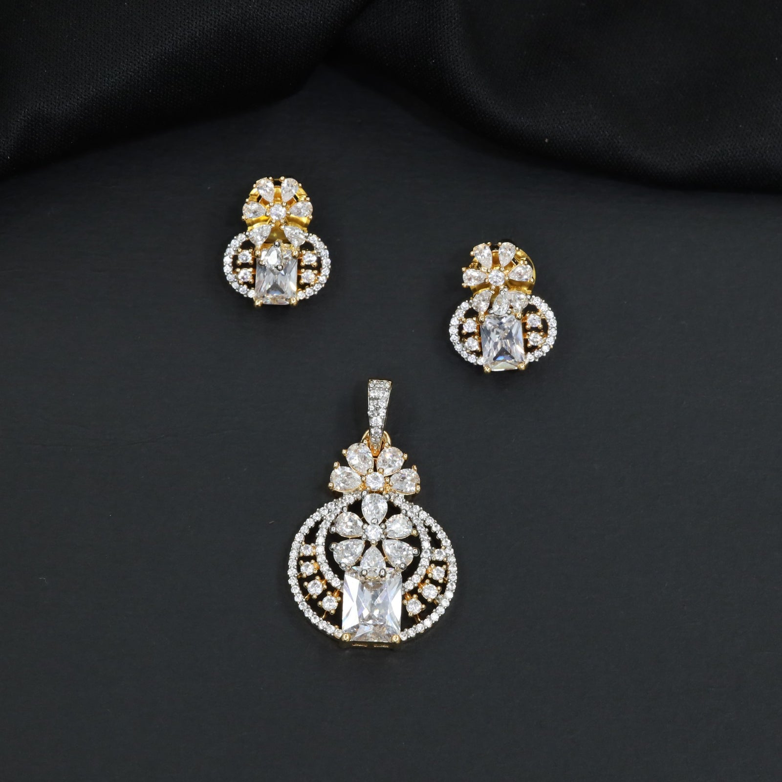 Contemporary floral pendant set showcasing geometric styling and petal cluster accents