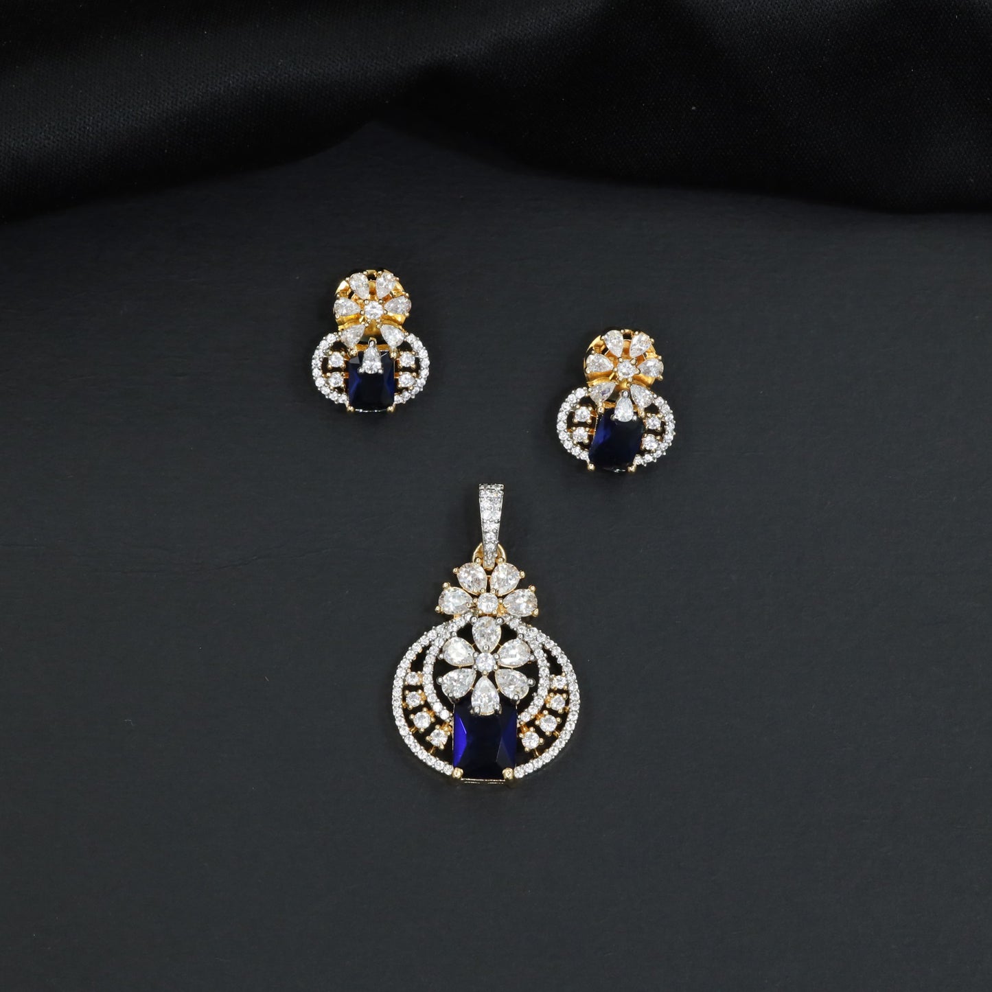 Contemporary floral pendant set showcasing geometric styling and petal cluster accents