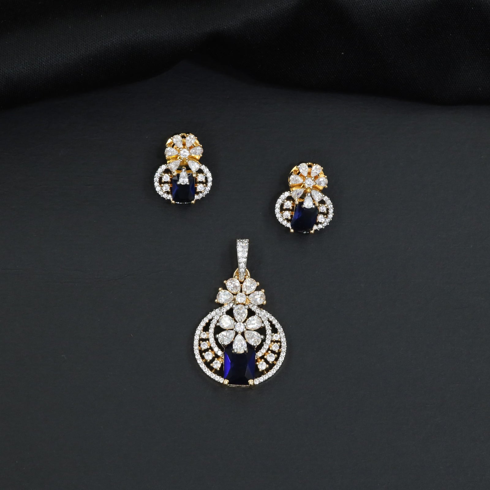 Contemporary floral pendant set showcasing geometric styling and petal cluster accents