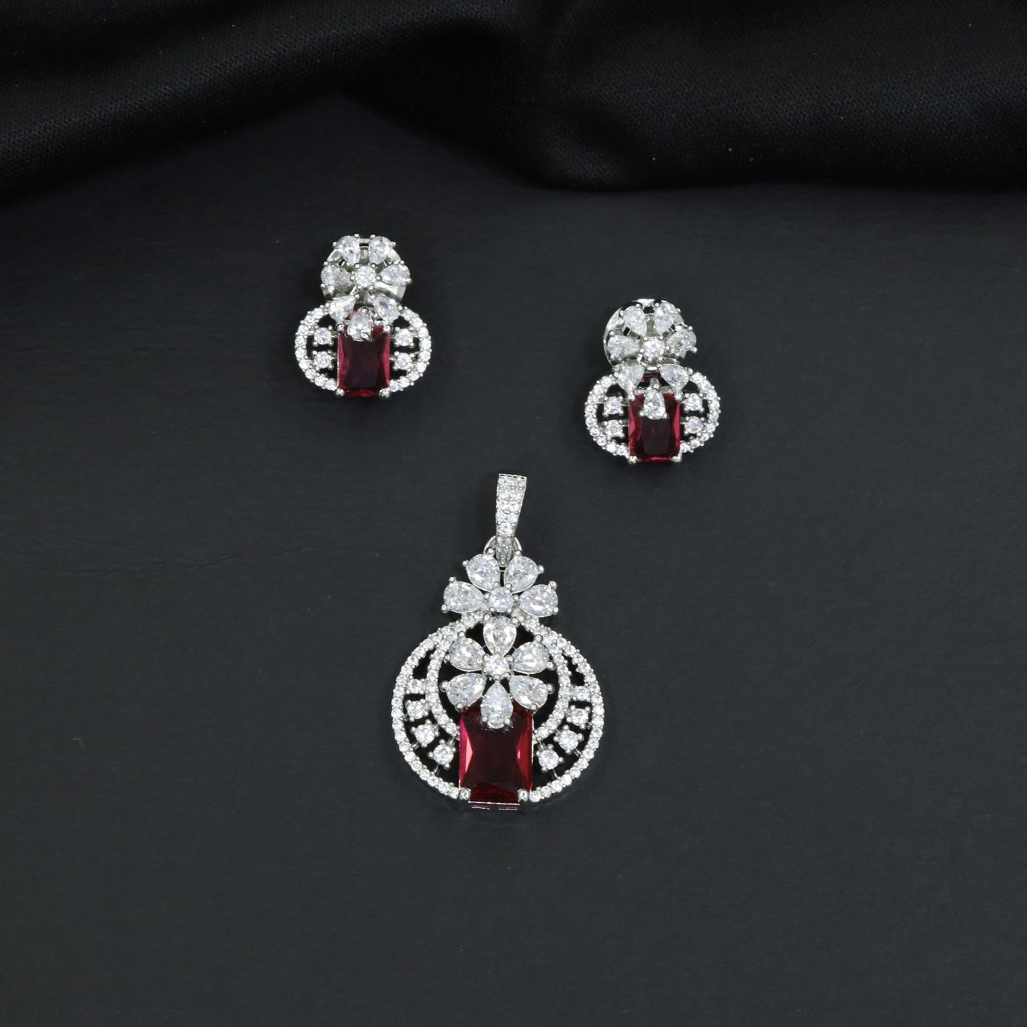 Contemporary floral pendant set showcasing geometric styling and petal cluster accents