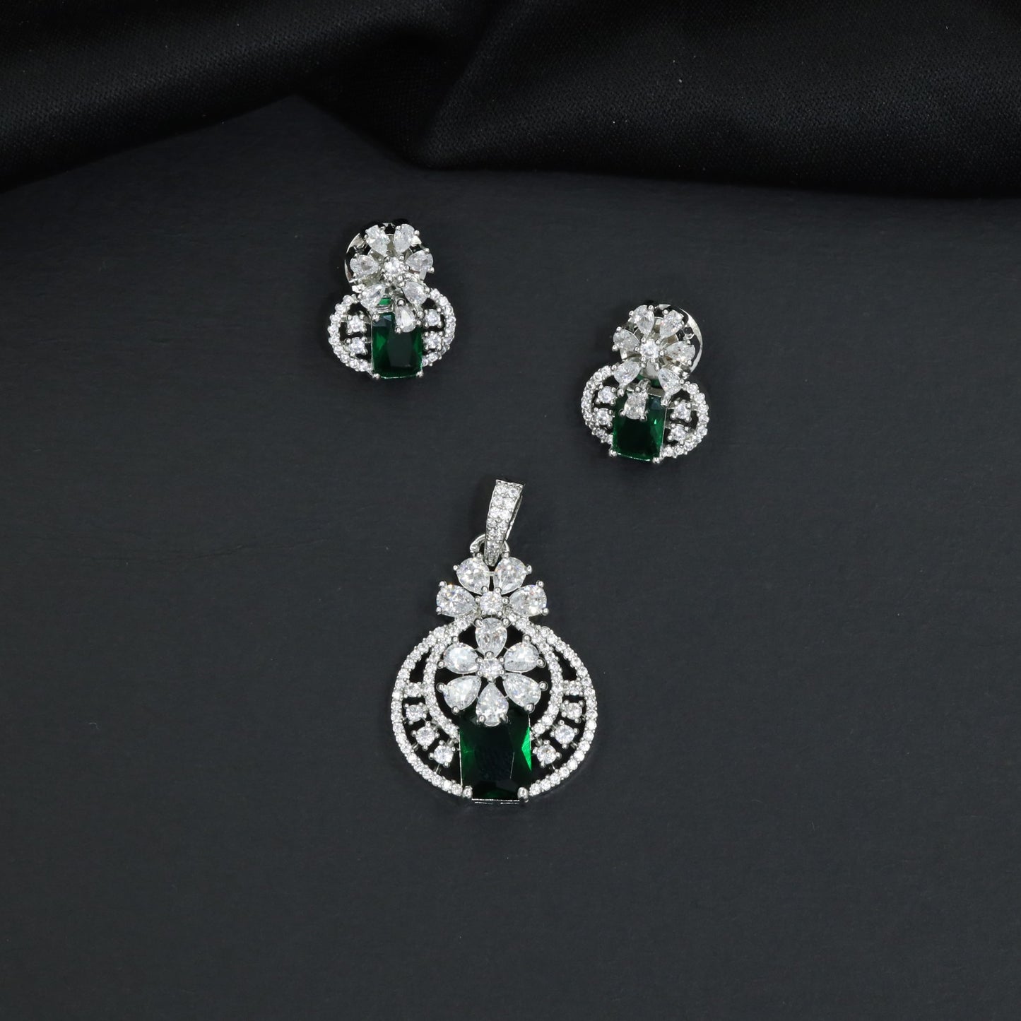Contemporary floral pendant set showcasing geometric styling and petal cluster accents