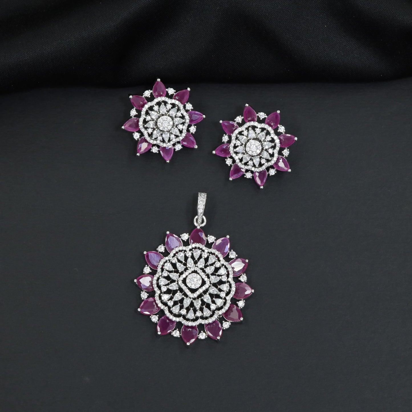Elegant flower pendant set with layered floral construction and statement centerpiece