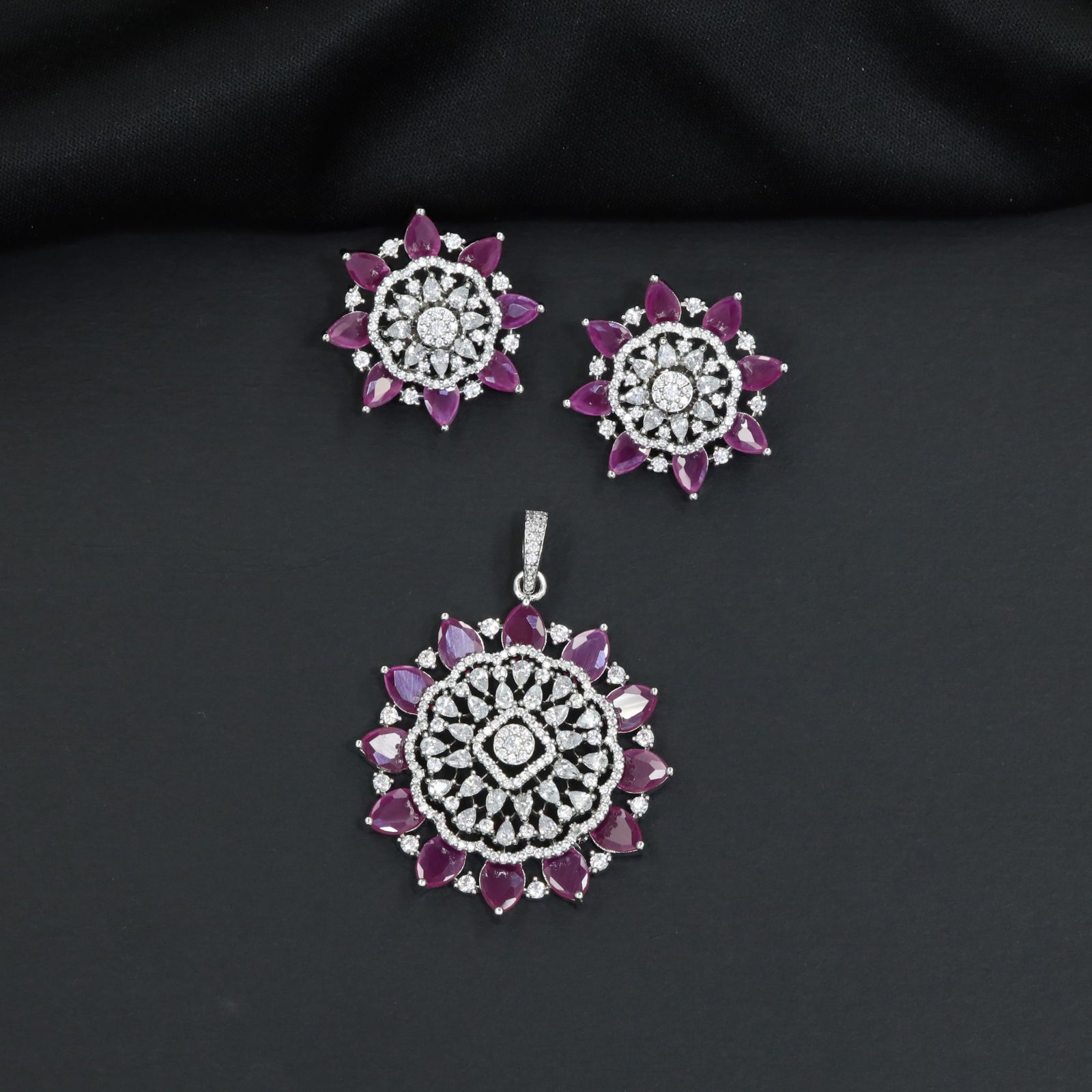 Elegant flower pendant set with layered floral construction and statement centerpiece