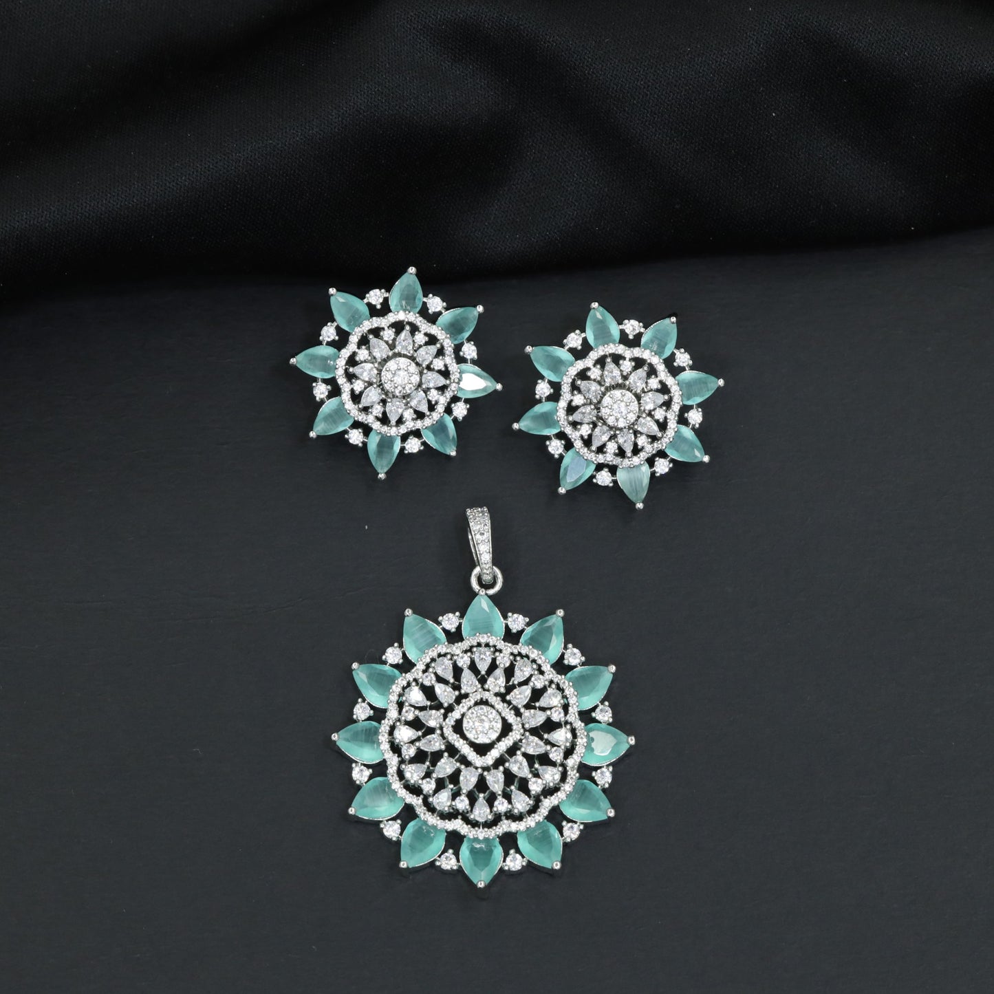 Elegant flower pendant set with layered floral construction and statement centerpiece