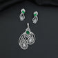 Artistic floral pendant set featuring twin leaf silhouettes and layered flower clusters