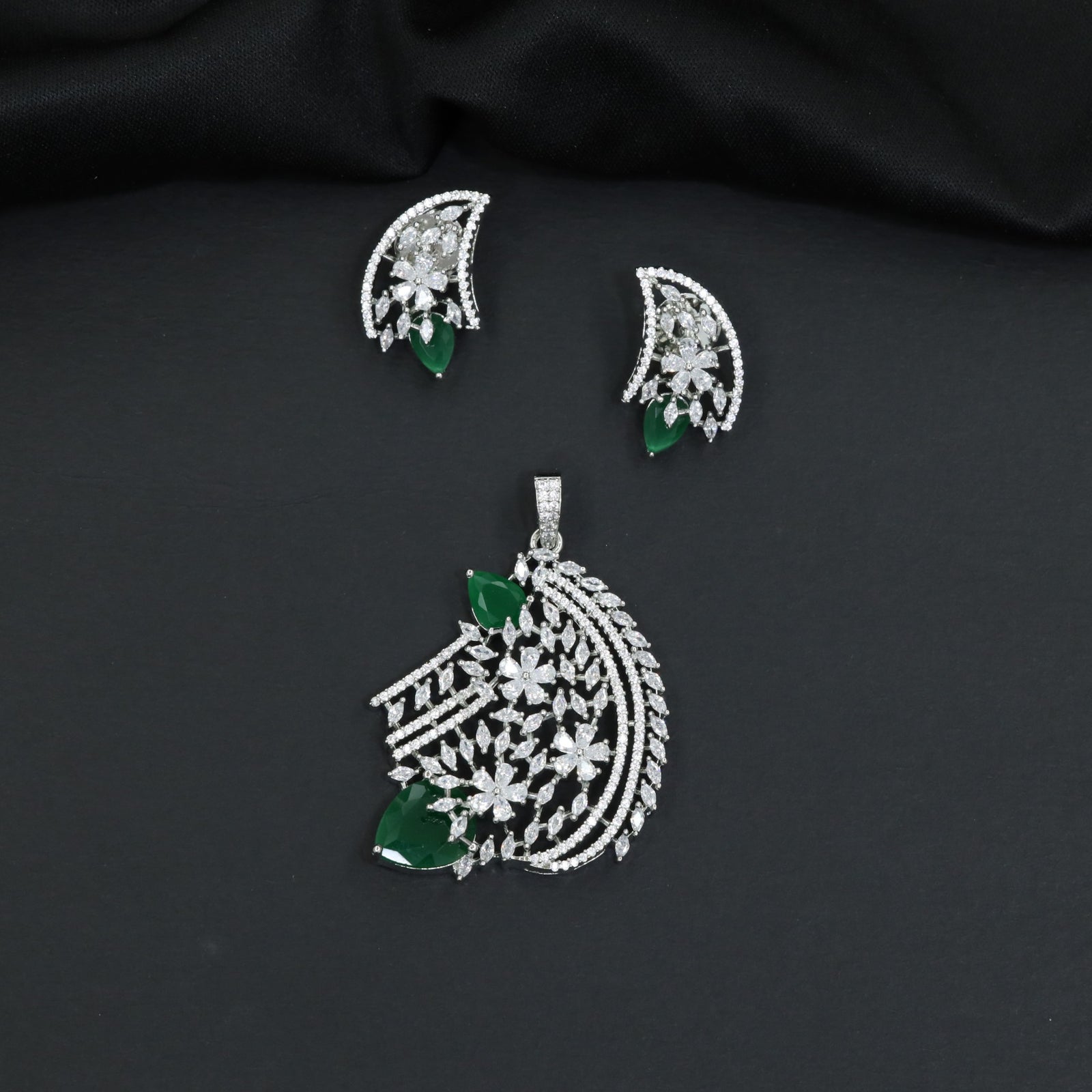 Floral bouquet pendant set with cascading leaf formations and matching earrings