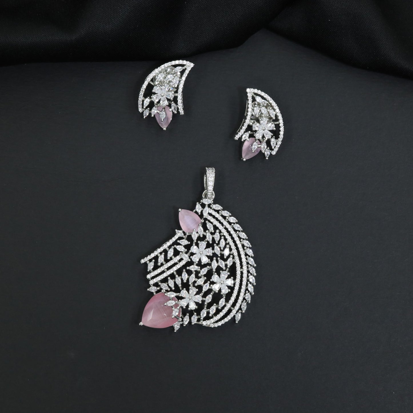 Floral bouquet pendant set with cascading leaf formations and matching earrings