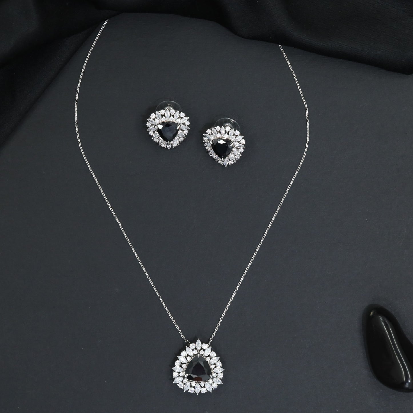 Elegant pendant chain set with a floral burst frame and teardrop focal element