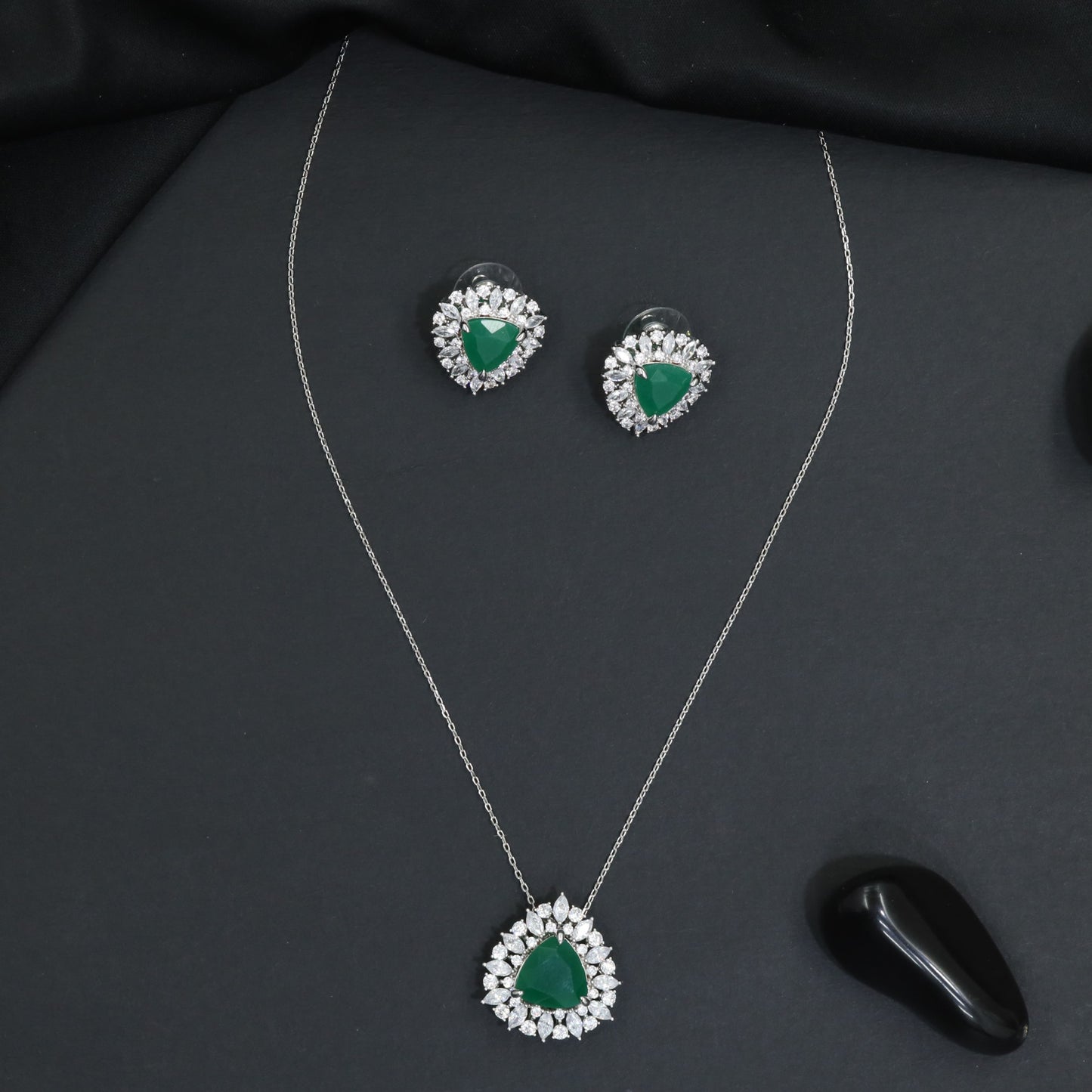 Elegant pendant chain set with a floral burst frame and teardrop focal element