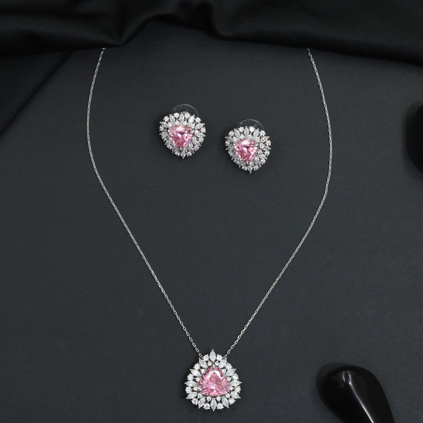 Elegant pendant chain set with a floral burst frame and teardrop focal element