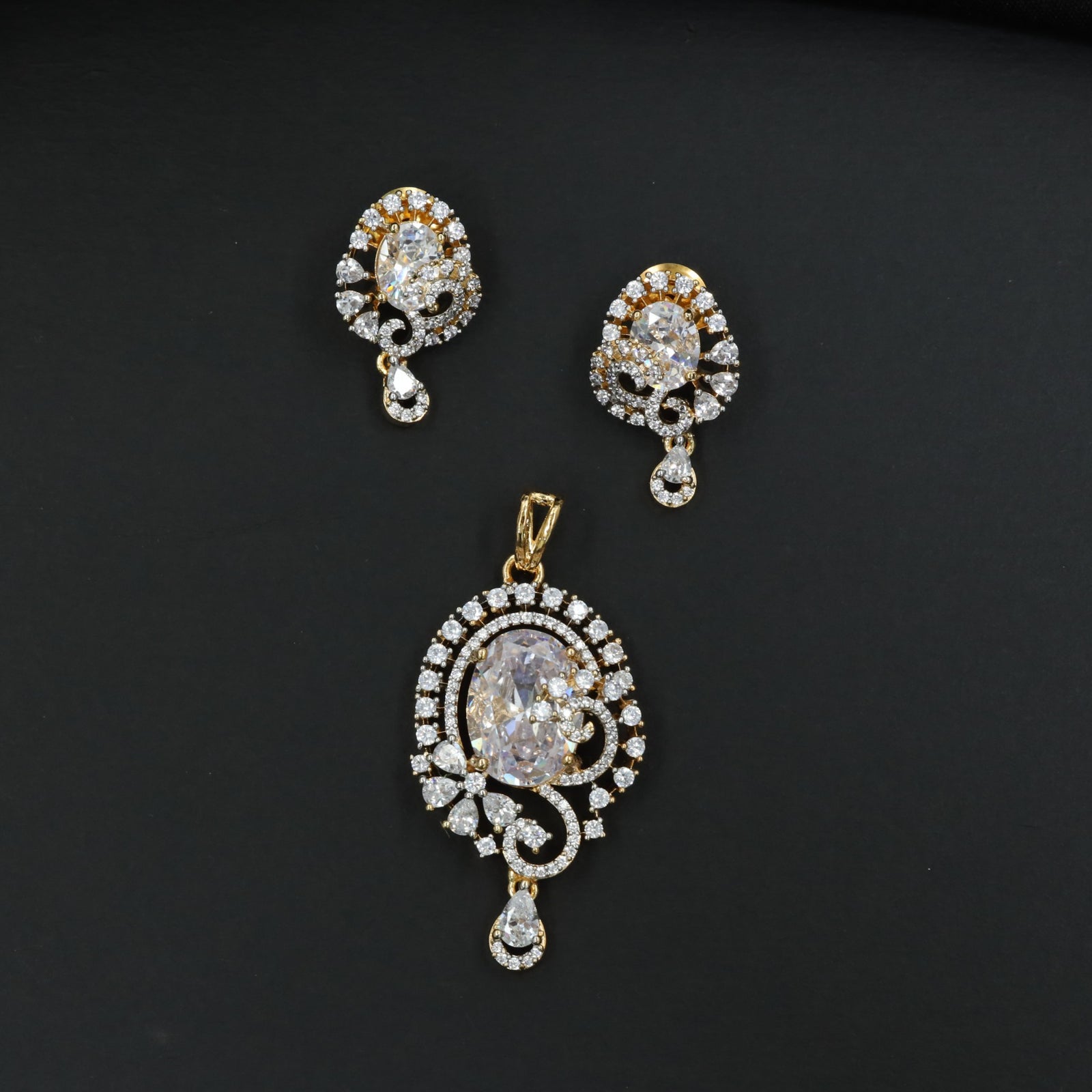 Statement floral pendant set showcasing curved vine craftsmanship and petal clusters