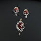 Statement floral pendant set showcasing curved vine craftsmanship and petal clusters