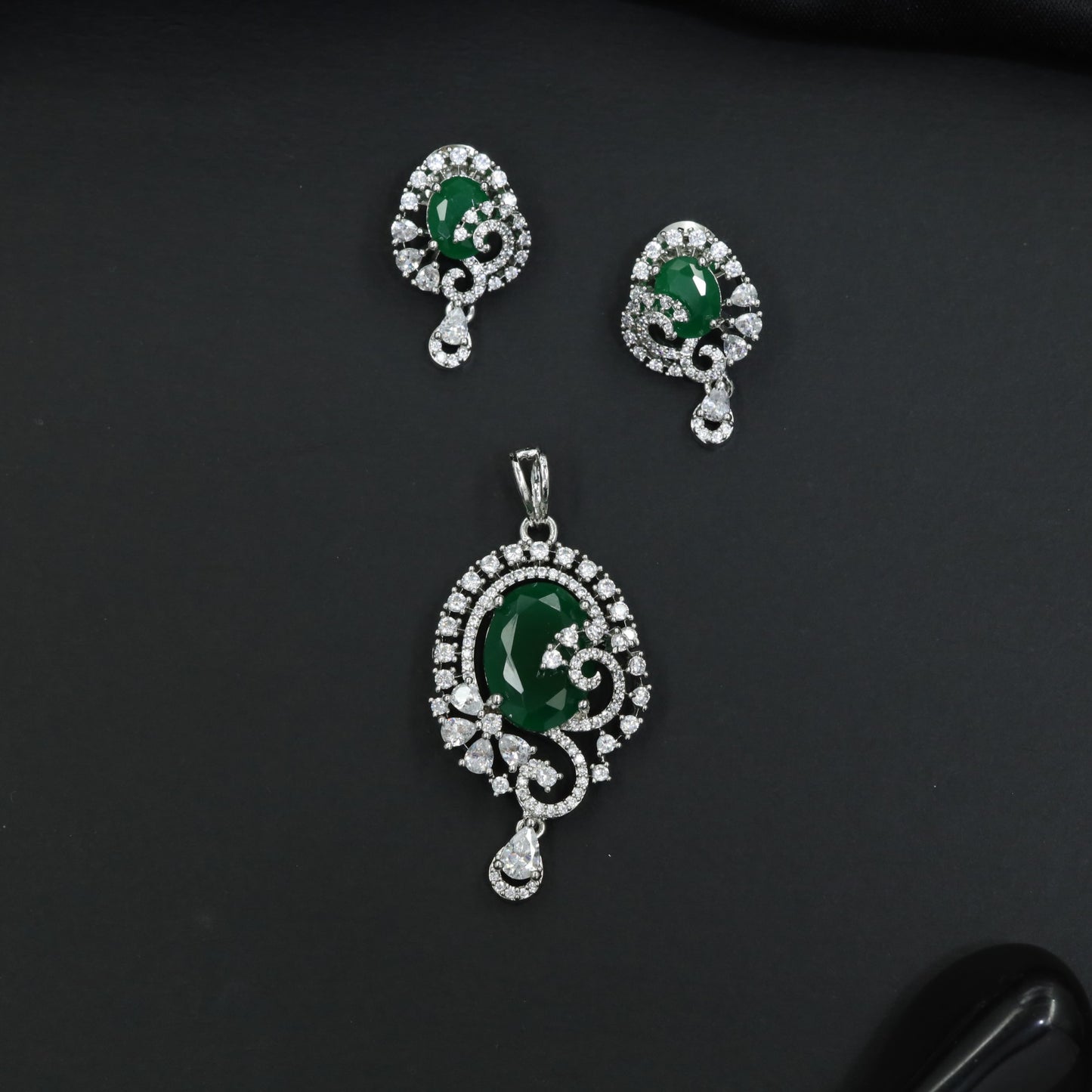 Statement floral pendant set showcasing curved vine craftsmanship and petal clusters