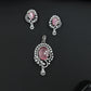 Statement floral pendant set showcasing curved vine craftsmanship and petal clusters