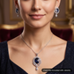 Statement floral pendant set showcasing curved vine craftsmanship and petal clusters