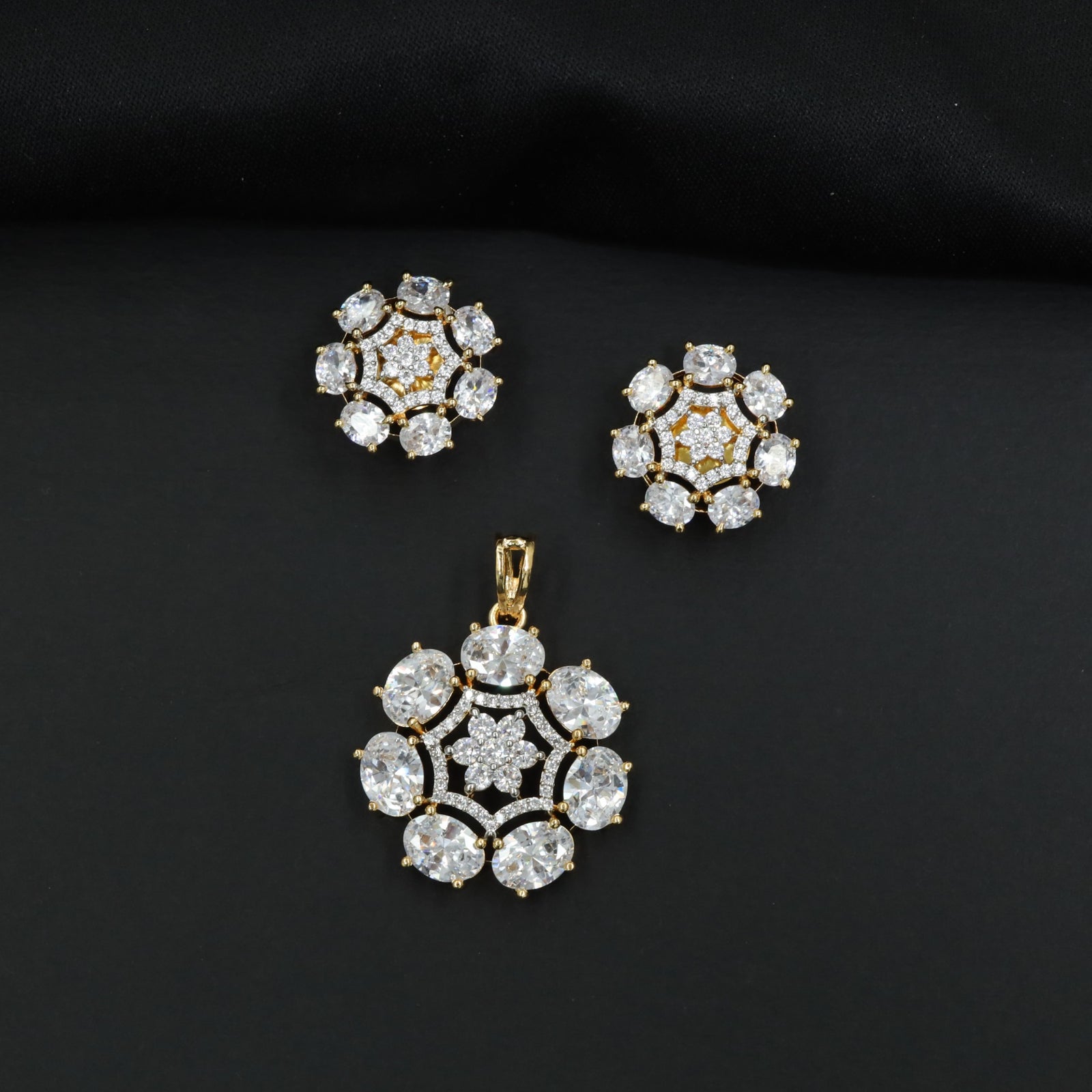 Statement floral pendant set featuring a flower bloom centerpiece and circular petal arrangement