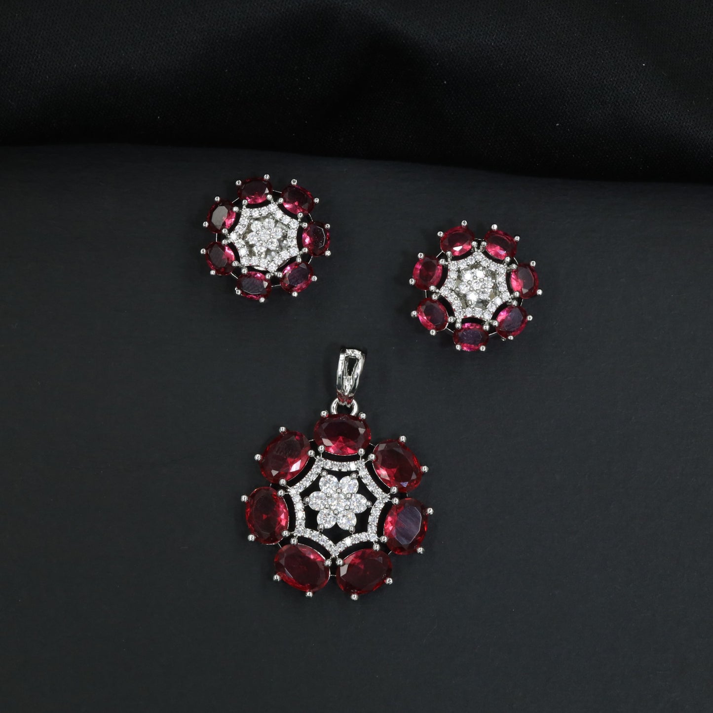 Statement floral pendant set featuring a flower bloom centerpiece and circular petal arrangement