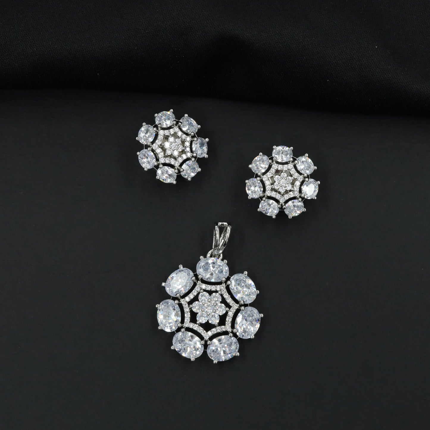 Statement floral pendant set featuring a flower bloom centerpiece and circular petal arrangement