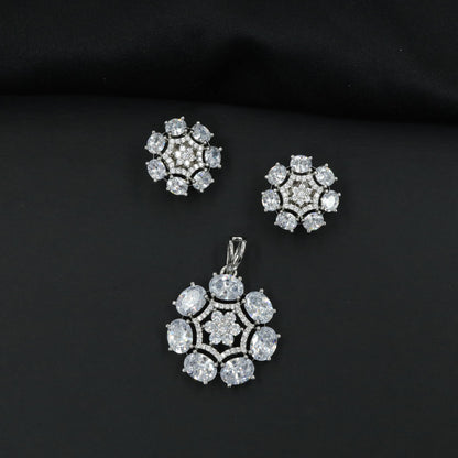 Statement floral pendant set featuring a flower bloom centerpiece and circular petal arrangement
