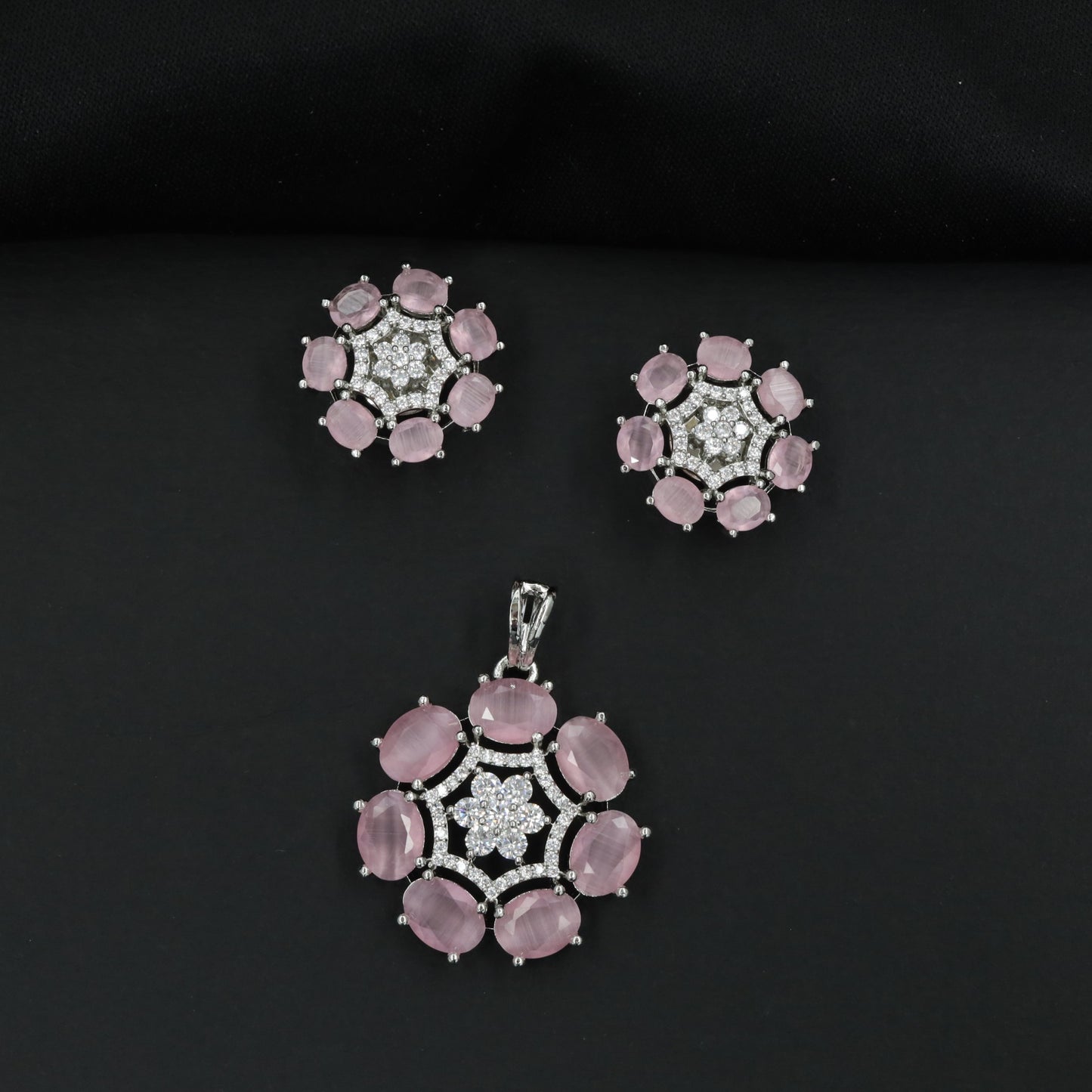 Statement floral pendant set featuring a flower bloom centerpiece and circular petal arrangement